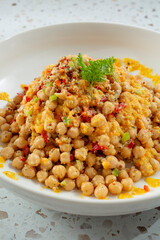 A view of a bowl of garbanzo salad.