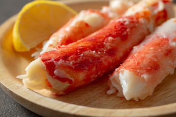 A closeup view of a plate of king crab leg meat.
