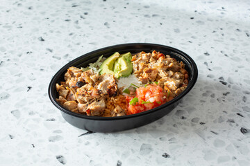 A view of a Mexican restaurant style chicken bowl.