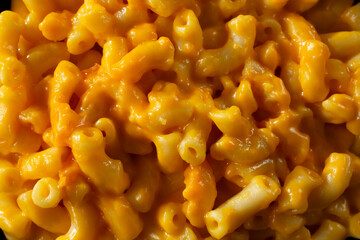 A closeup view of mac n cheese, as a background.