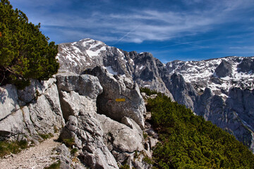 Fototapeta premium Tunnel through mountain on a walking path at the Eagle's Nest on a spring day in Germany.