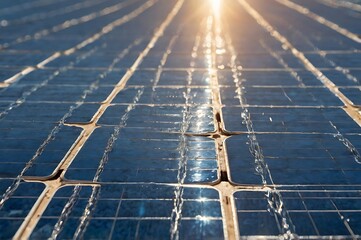 Close Up Of A Solar Panel’s Surface With Visible Blue Crystalline Patterns Under Bright Sunlight