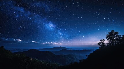 Naklejka premium Stunning night sky over mountain landscape with starry heavens and serene natural scenery. Perfect for astronomy and nature themes.