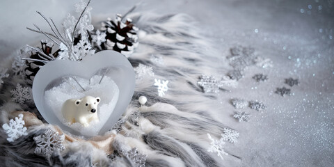 Obraz premium Heart Shaped Winter Scene with Polar Bear Figurine Snowflakes and Pine Cones