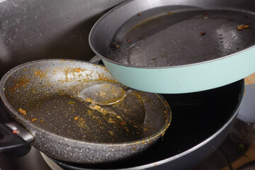 Dirty Cookware is Piling Up in the Kitchen Sink and Needs Attention