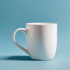 Obraz premium Blank white mug on blue background.
