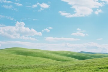 Fototapeta premium Serene Green Hills Under a Clear Blue Sky