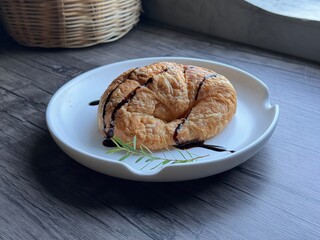 The croissant on a white plate