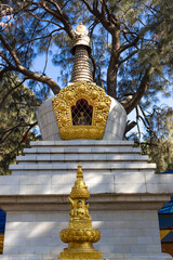 Statue of Buddha along with one of the stupa in Buddha Park, Swayambhunath, Kathmandu, Nepal