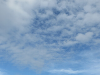 White Fluffy Clouds in a Vast Blue Expanse - Nature’s Minimalist Masterpiece in Dong Hoi, Quang Binh, Vietnam