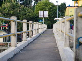 straight road on bridges and fences made of iron pipes
