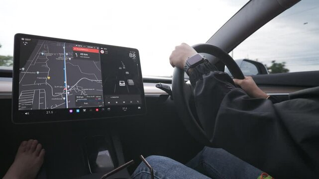 Woman use GPS navigater screen in EV car travel trip transport technology