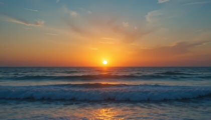 Obraz premium Ocean Sunset: Golden Hues and Gentle Waves
