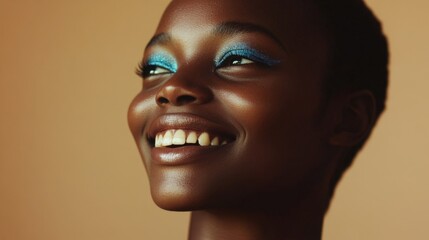 African young woman smiling with blue eye makeup