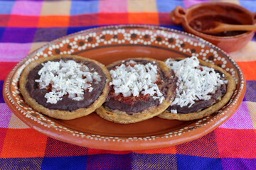 Sopes prepared with beans, cheese and salsa