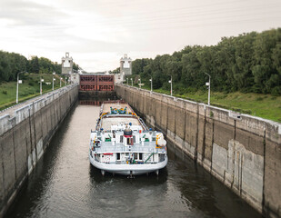 Fototapeta premium tow barge in canal gateway. Moscow, Russia