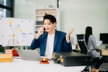 Attractive young lawyer in office Business man and lawyers discussing contract papers laptop