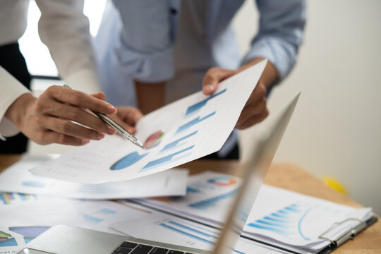 Business accountant working audit inspect calculating expense annual financial report balance sheet statement, doing finance making notes checking document and data analysis profit graph