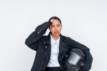 Fototapeta premium A young female motorcycle delivery driver looking annoyed and exasperated, gritting her teeth. Isolated on a white background.