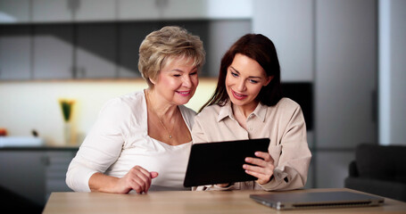 Teaching Tablet To Senior Woman