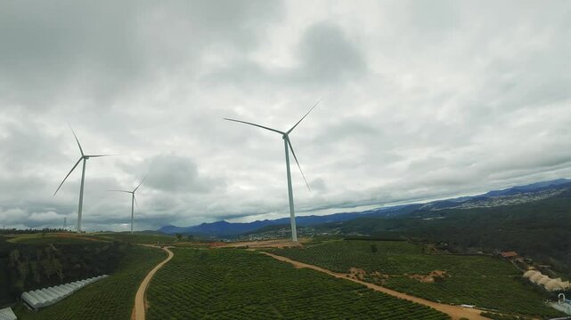 FPV Drone Short, Wind Turbines Network in Scenic Rural Landscape at Sunset