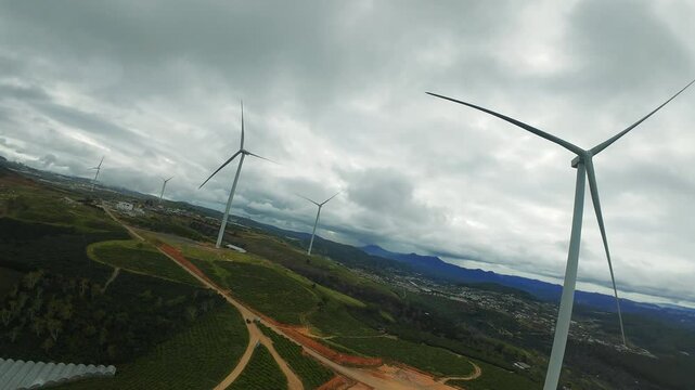 FPV Drone Short, Wind Turbines Network in Scenic Rural Landscape at Sunset