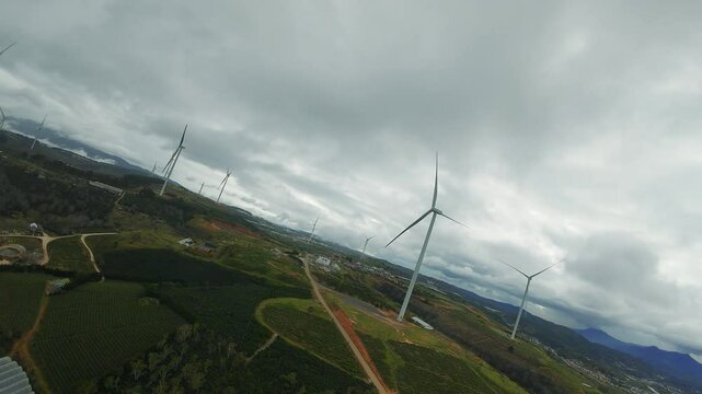 FPV Drone Short, Wind Turbines Network in Scenic Rural Landscape at Sunset