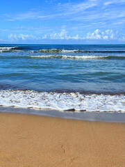 Sea waves on sand beach 