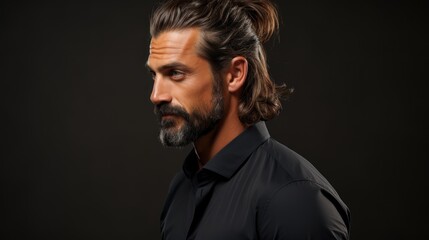 Obraz premium Portrait of a Handsome Man with a Beard and Long Hair