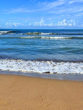 Sea waves on sand beach 