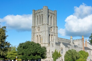 Fototapeta premium Church tower, sunny day, green trees, historical site, tourism