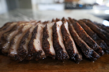 Sliced smoked brisket with bark
