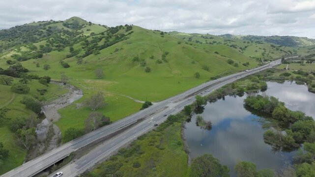 Rural highway byway running through rolling green hills