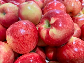 Closeup on yellow and red honeycrisp apples at supermarket