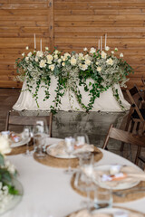 Decorated wedding table of the bride and groom in the hall