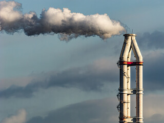 Chimneys of an industrial factory emitting thick pollution smoke, Concept of environmental impact,...