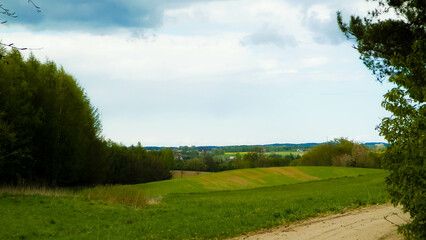 Obraz premium Rural road through Kashubian fields.