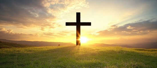 A cross silhouette against the backdrop of an Easter sunrise, symbolizing hope and Jesus' triumph, in handwritten font text