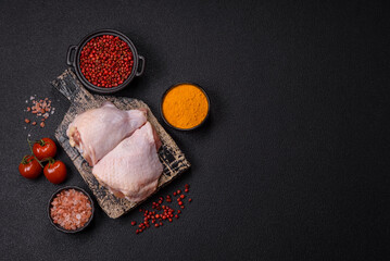 Fresh raw chicken thighs with salt and spices