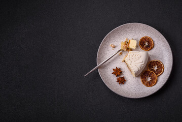 Piece of cheesecake with nuts and berries with winter pattern