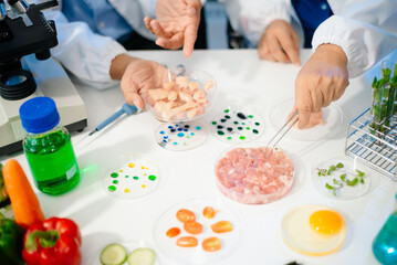 Team of scientists examining food samples in a lab with microscopes. Perfect for themes of food science, biotechnology,
