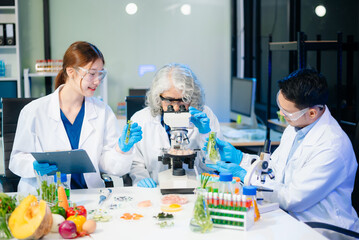 Team of scientists examining food samples in a lab with microscopes. Perfect for themes of food science, biotechnology,