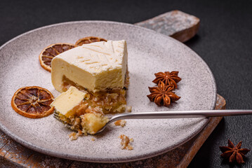 Piece of cheesecake with nuts and berries with winter pattern