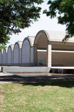 Arched buildings with trees in foreground