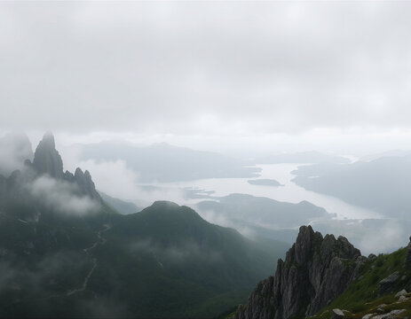 Misty Mountain Peaks with Dramatic Foggy Valley Landscape in Moody Weather