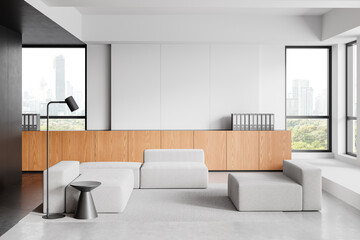 Modern office lounge area with minimalist furniture and large windows overlooking cityscape and greenery. 3D Rendering