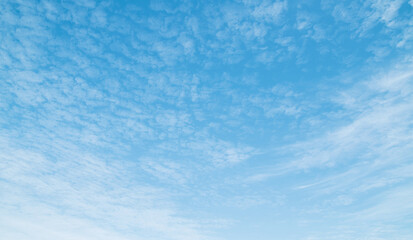 the sky is filled with fluffy white clouds, quiet and beautiful.