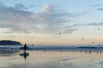 Surfer at Hobuck Beach in the Olympic Peninsula on the far northwest corner of Washington
