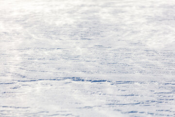 The snow is white and the ground is covered in it