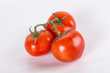 Sweet ripe tomatoes on the branch